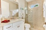Second hallway full-bathroom, features a walk-in shower, providing easy accessibility